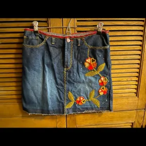 BEBE floral embroidered denim mini skirt